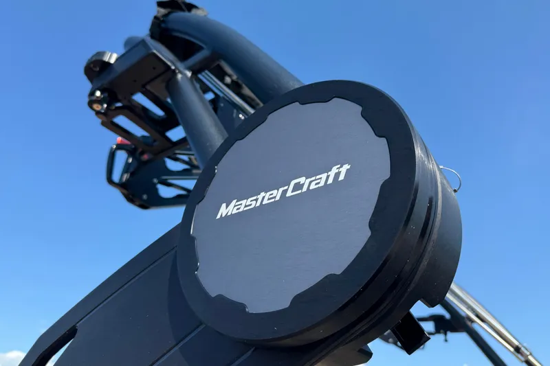 Slide: The Image of 2025 MasterCraft XT24 boat detail against clear blue sky. - 4