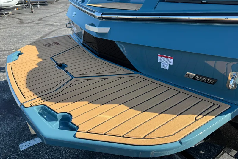 Slide: The Image of 2025 MasterCraft XT24 boat with teak swim platform and SurfStar feature. - 5