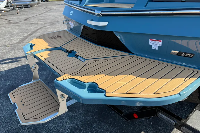 Slide: The Image of 2025 MasterCraft XT24 boat with teak swim platform and SurfStar technology. - 6