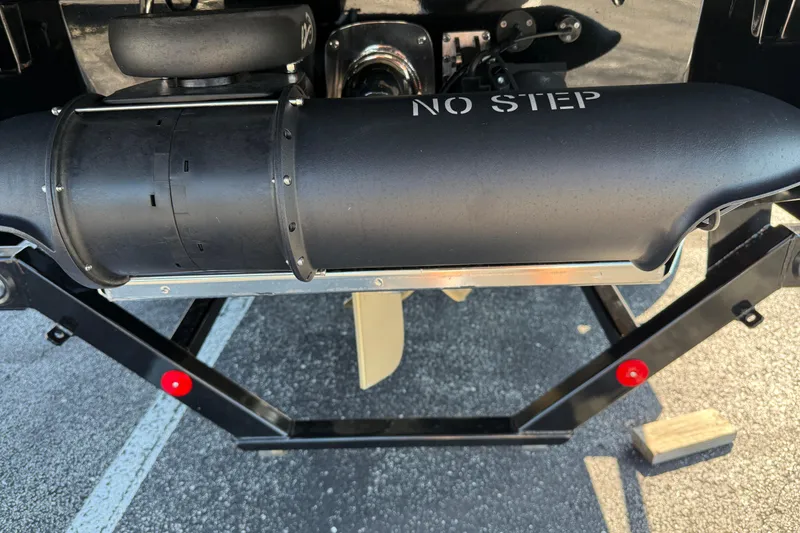 Slide: The Image of 2025 MasterCraft XT24 boat underside with "No Step" warning on black component. - 8