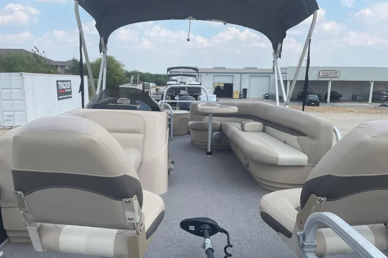 Slide: The Image of 2016 Sun Tracker Fishin' Barge 20 DLX pontoon boat with beige seating and canopy. - 6