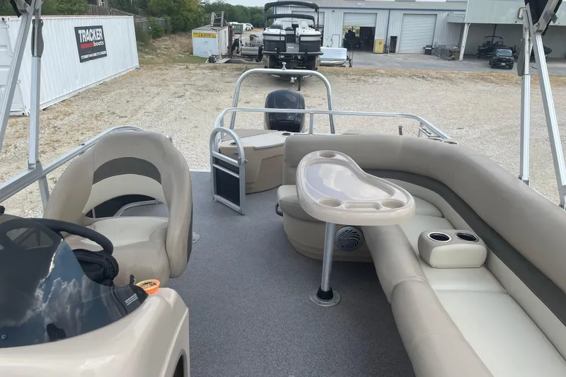 Slide: The Image of 2016 Sun Tracker Fishin' Barge 20 DLX interior with seating and helm. - 7