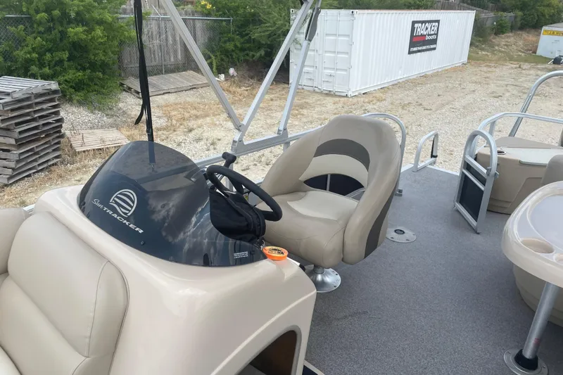 Slide: The Image of 2016 Sun Tracker Fishin' Barge 20 DLX interior with steering console and seating. - 8