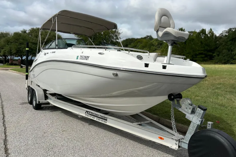 Slide: The Image of 2017 Hurricane SD 2486 boat with seating, parked on a trailer. - 11