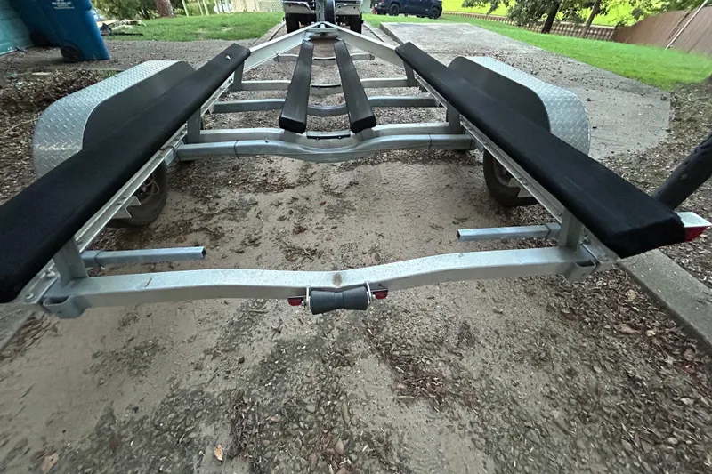 Slide: The Image of Boat trailer winch mechanism on a 2017 Hurricane SD 2486, parked near a lake. - 29