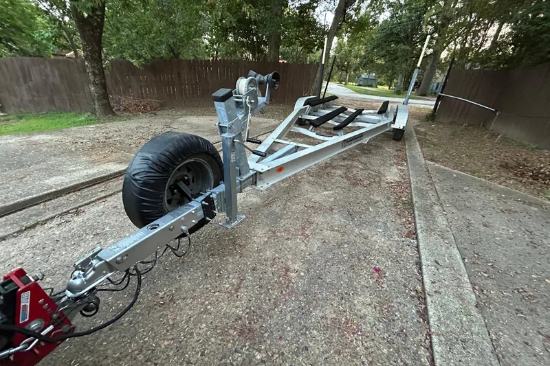 Slide: The Image of Boat trailer for 2017 Hurricane SD 2486, featuring padded supports and diamond plate step. - 35