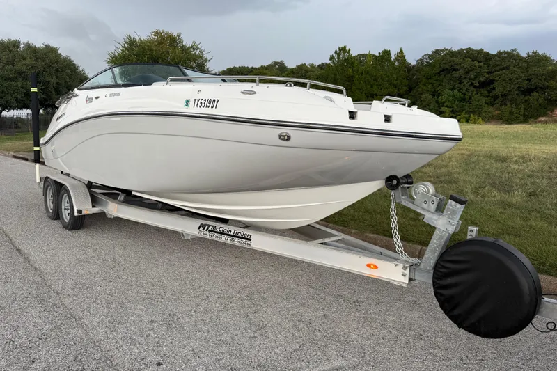 Slide: The Image of Trailer hitch of a 2017 Hurricane SD 2486 boat on a road. - 38