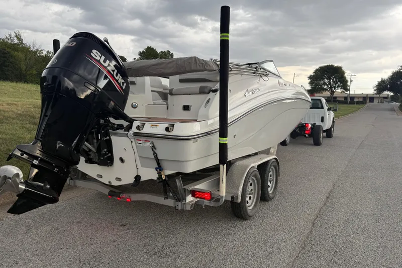 Slide: The Image of 2017 Hurricane SD 2486 boat with seating, parked on a road. - 4