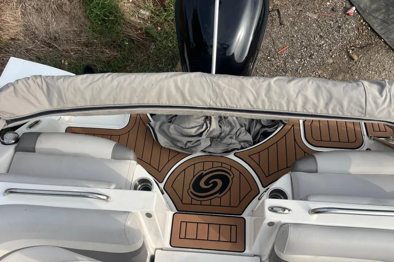 Slide: The Image of 2017 Hurricane SD 2486 boat interior with gray seating and cup holder. - 43