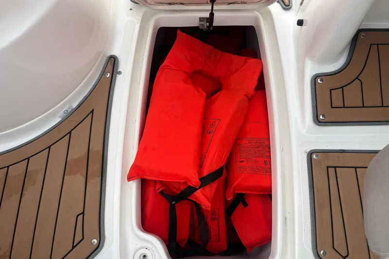 Slide: The Image of 2017 Hurricane SD 2486 boat interior with stylish wood-patterned flooring and cushioned seating. - 44