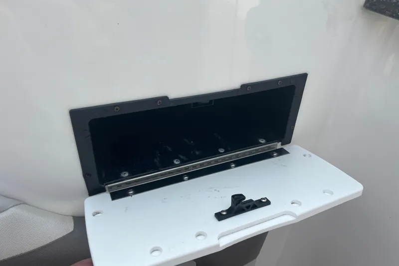 Slide: The Image of Red life jackets stored in a compartment of a 2017 Hurricane SD 2486 boat. - 45