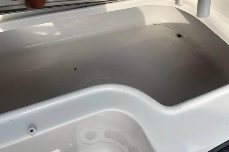 Slide: The Image of Open storage compartment in 2017 Hurricane SD 2486 boat. - 47