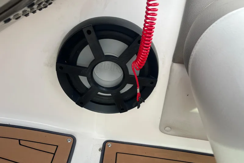 Slide: The Image of 2017 Hurricane SD 2486 boat dashboard with steering wheel, gauges, and Garmin GPS. - 49