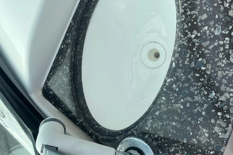 Slide: The Image of Boat safety and capacity warnings on a 2017 Hurricane SD 2486, maximum 14 persons or 1900 lbs. - 51