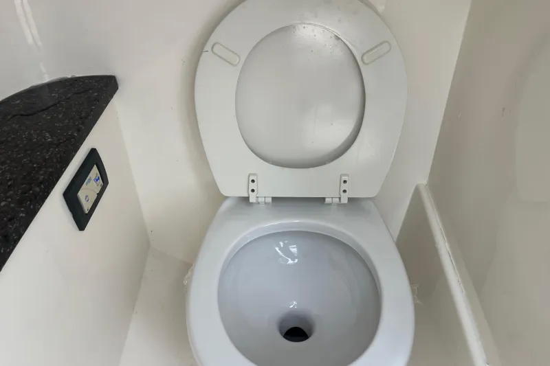 Slide: The Image of Interior of 2017 Hurricane SD 2486 boat with black countertop and control panel. - 53