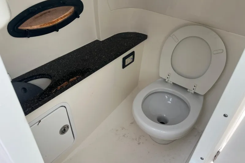 Slide: The Image of 2017 Hurricane SD 2486 boat interior with sink and porthole window. - 55