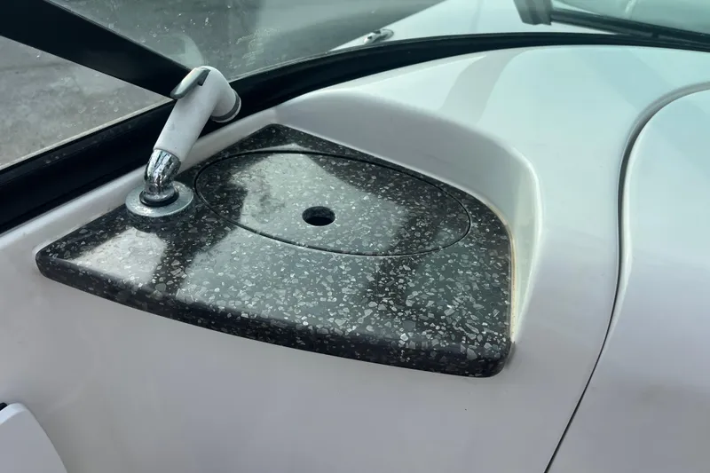 Slide: The Image of 2017 Hurricane SD 2486 boat bathroom with toilet and countertop. - 56