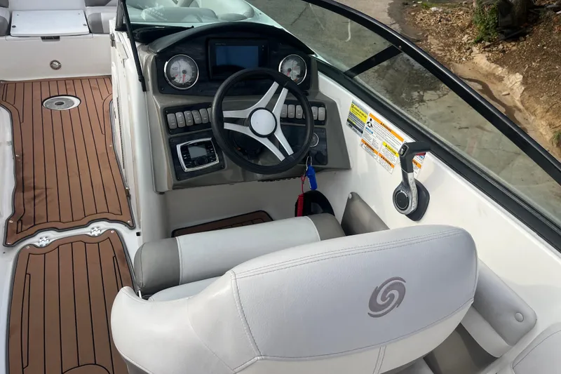 Slide: The Image of Interior of 2017 Hurricane SD 2486 boat with white seating and wood-style flooring. - 58