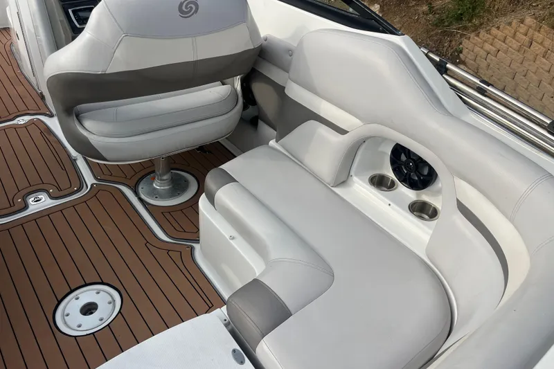 Slide: The Image of 2017 Hurricane SD 2486 boat interior with white seating and brown deck flooring. - 60