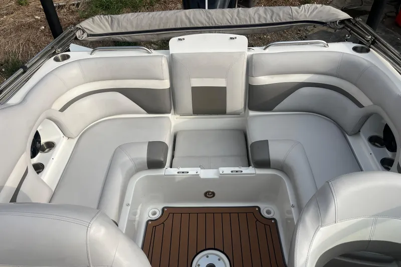 Slide: The Image of 2017 Hurricane SD 2486 boat interior with white seating and wood-style flooring. - 62