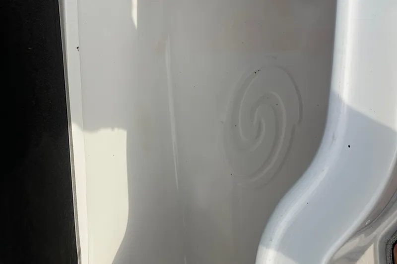 Slide: The Image of 2017 Hurricane SD 2486 boat interior with cushioned seating and wood-style flooring. - 67