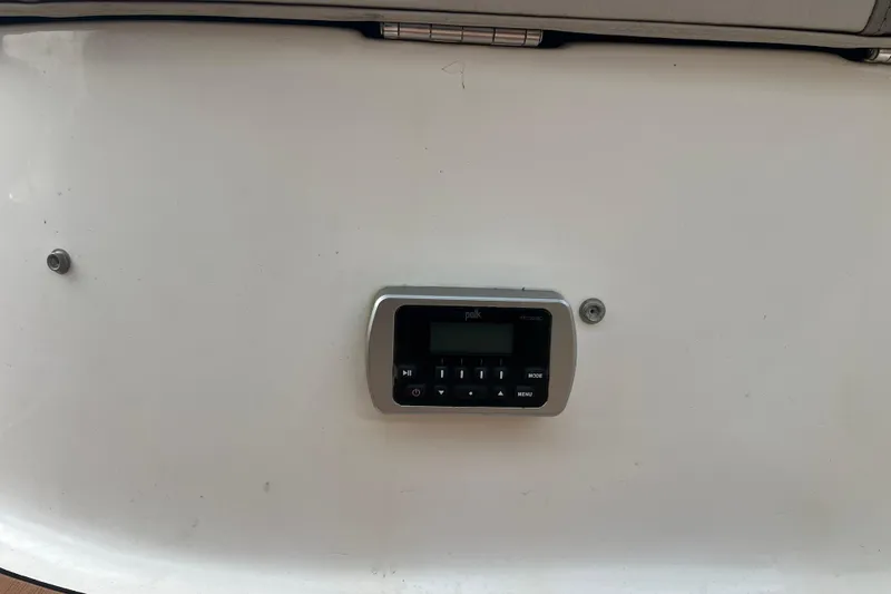 Slide: The Image of 2017 Hurricane SD 2486 boat interior with white seating and wood flooring. - 74