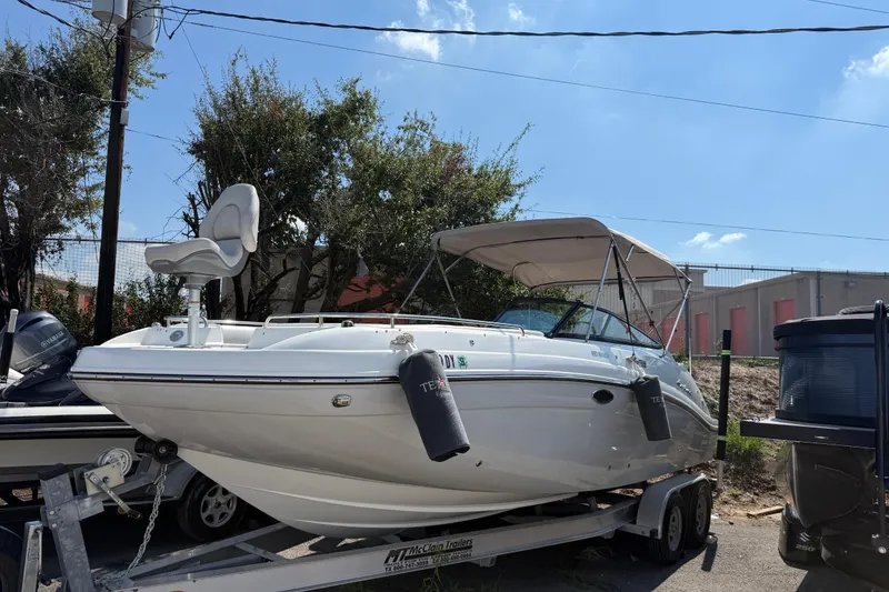Slide: The Image of 2017 Hurricane SD 2486 boat with powerful 250 HP outboard motor, parked on street. - 8