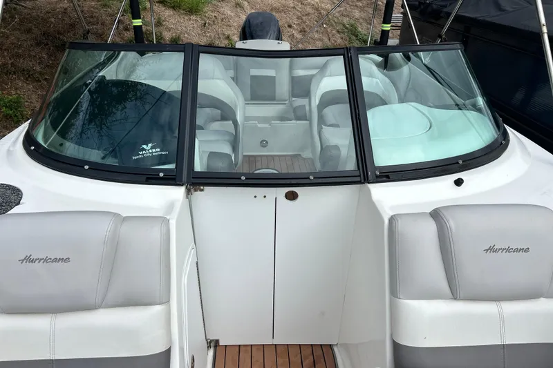 Slide: The Image of 2017 Hurricane SD 2486 boat interior with gray seating and wood flooring. - 81