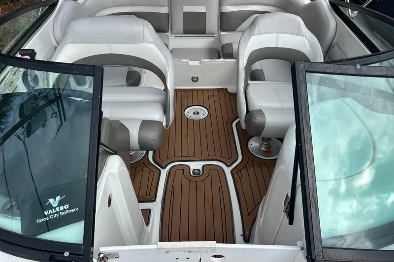 Slide: The Image of 2017 Hurricane SD 2486 boat interior with wooden flooring and white paneling. - 83