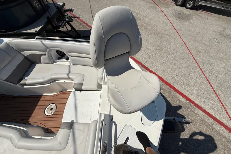 Slide: The Image of 2017 Hurricane SD 2486 boat interior with white seating and wood flooring. - 89