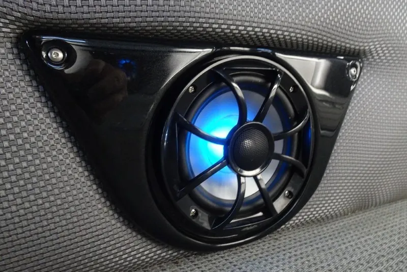 Slide: The Image of 2024 Regency 250 LE3 speaker with blue LED light on textured surface. - 12