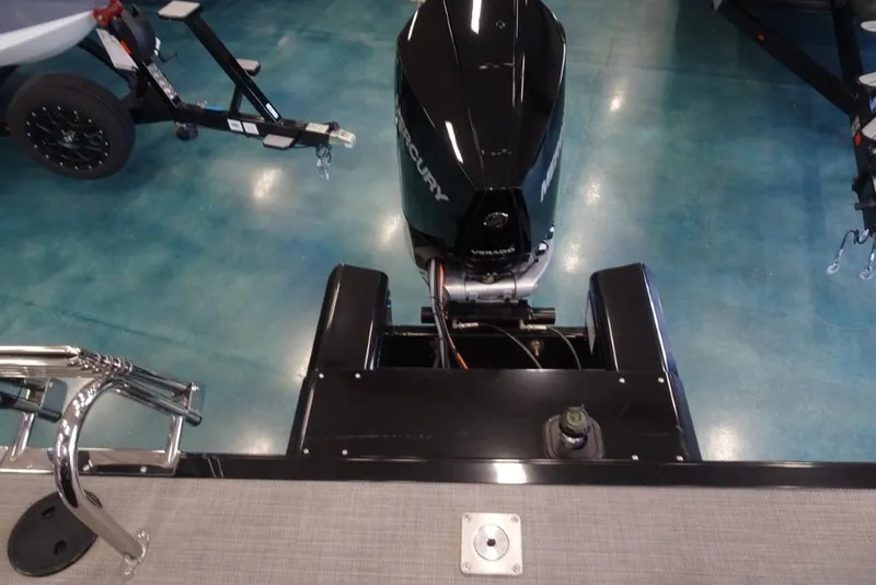 Slide: The Image of 2024 Regency 250 LE3 boat with Mercury outboard motor in showroom. - 22