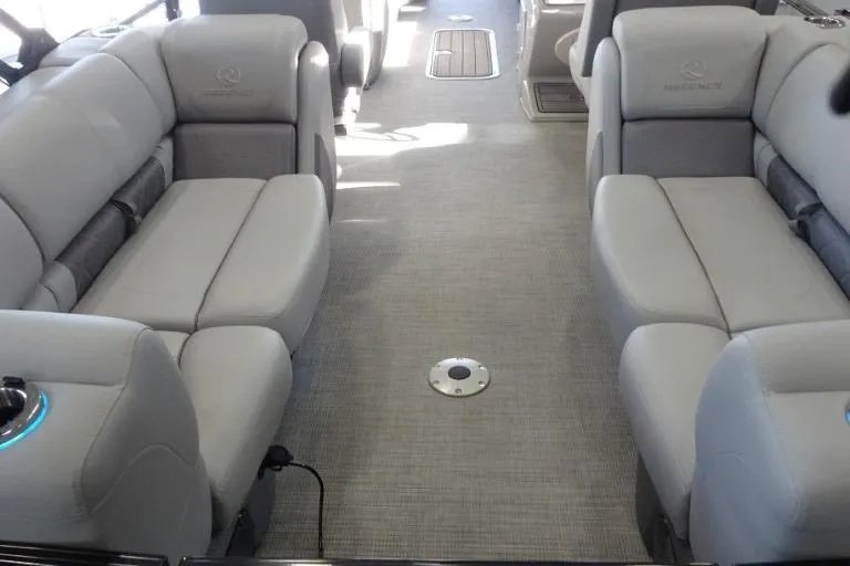 Slide: The Image of 2024 Regency 250 LE3 boat interior with plush gray seating and modern design. - 23