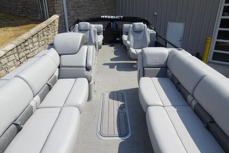 Slide: The Image of 2024 Regency 250 LE3 pontoon boat with luxurious gray seating and spacious layout. - 25