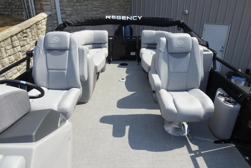 Slide: The Image of 2024 Regency 250 LE3 pontoon boat interior with luxurious seating and modern design. - 27