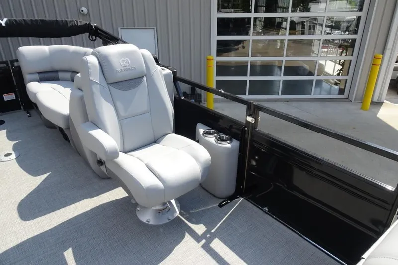 Slide: The Image of 2024 Regency 250 LE3 boat interior with plush seating and cup holders. - 28