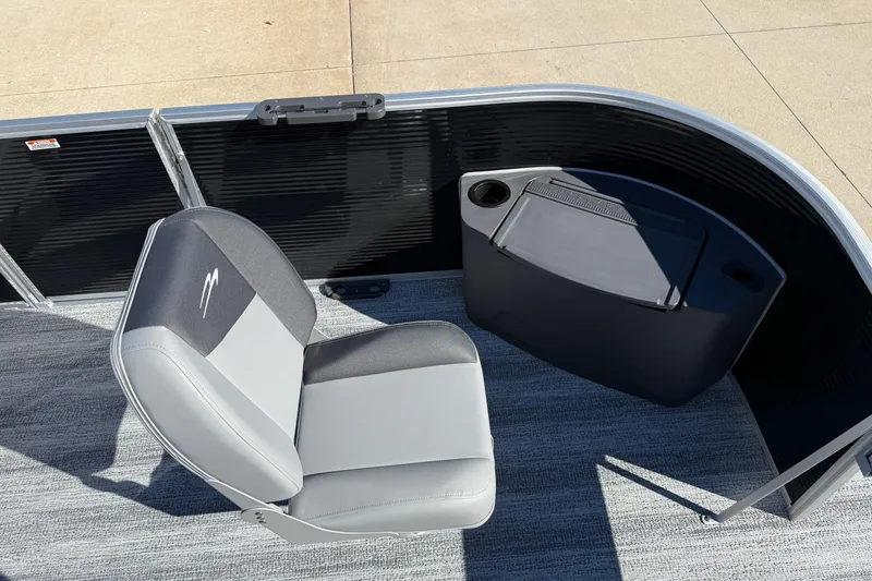 Slide: The Image of 2026 Bennington 168 SF Electric boat interior with gray seating and storage compartment. - 11