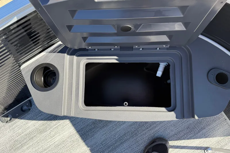 Slide: The Image of Open storage compartment on 2026 Bennington 168 SF Electric boat deck. - 12