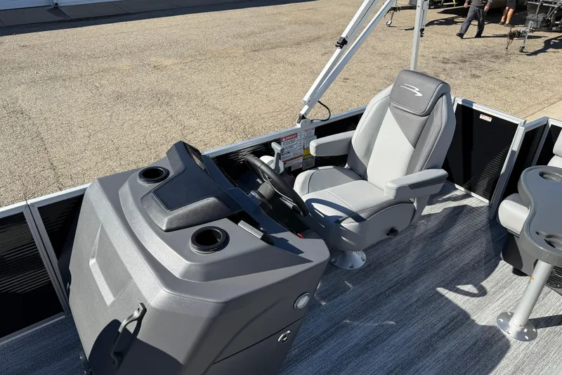 Slide: The Image of 2026 Bennington 168 SF Electric boat interior with captain's chair and control console. - 14