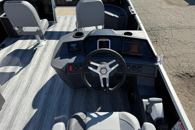 Slide: The Image of 2026 Bennington 168 SF Electric boat interior with steering console and seating. - 16