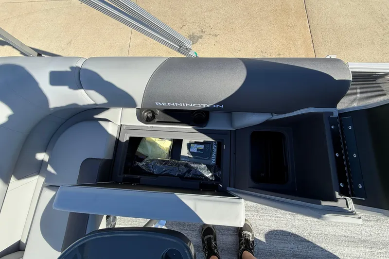 Slide: The Image of 2026 Bennington 168 SF Electric boat interior with storage compartments open. - 20