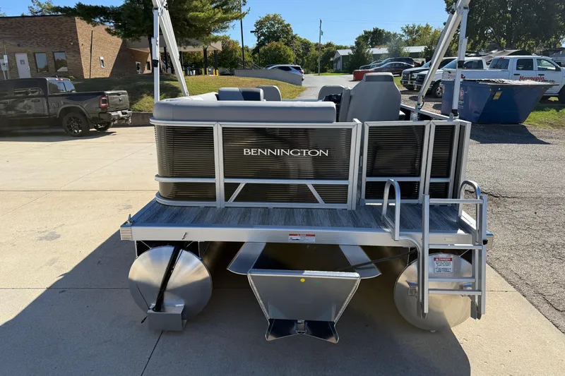 Slide: The Image of 2026 Bennington 168 SF Electric pontoon boat, rear view with ladder and seating. - 6