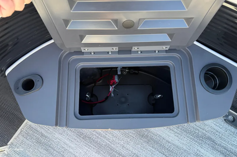 Slide: The Image of Open storage compartment on 2026 Bennington 168 SF Electric boat, showing interior wiring. - 9