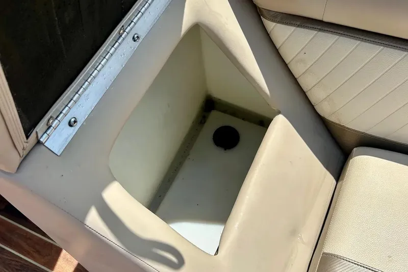 Slide: The Image of Open storage compartment in 2014 Crest 230 Crest II SLC boat seat. - 19