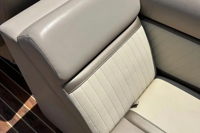 Slide: The Image of 2014 Crest 230 Crest II SLC boat seat with beige upholstery and striped flooring. - 20