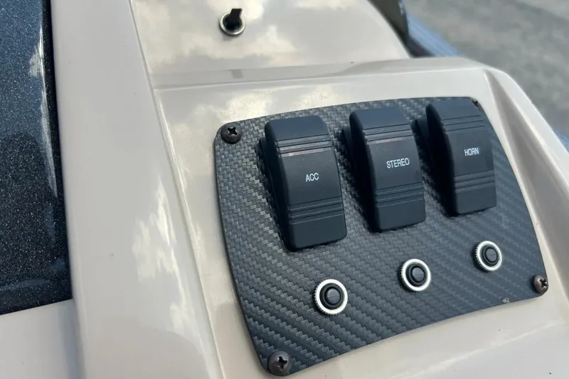 Slide: The Image of Control panel of 2014 Crest 230 Crest II SLC with switches for accessories, stereo, and horn. - 25