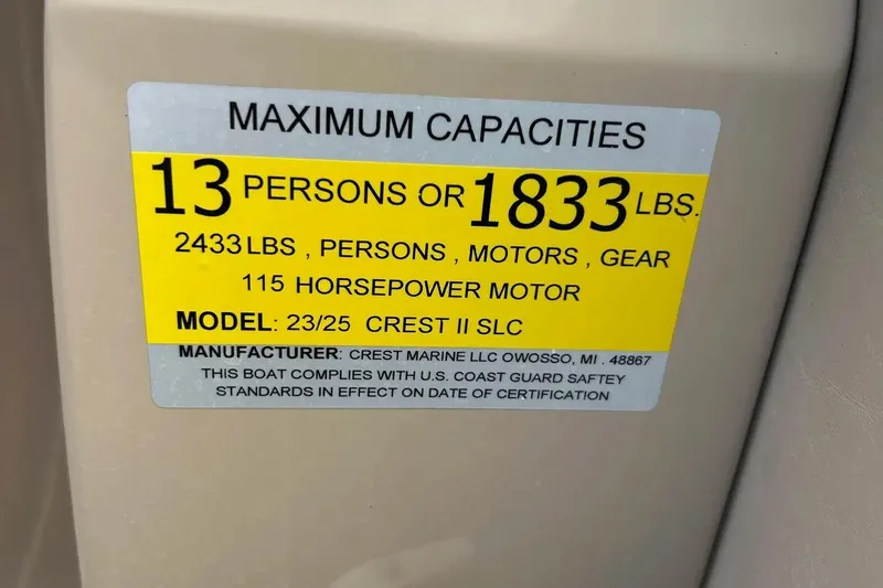 Slide: The Image of 2014 Crest 230 Crest II SLC capacity label: 13 persons, 1833 lbs, 115 horsepower motor. - 28