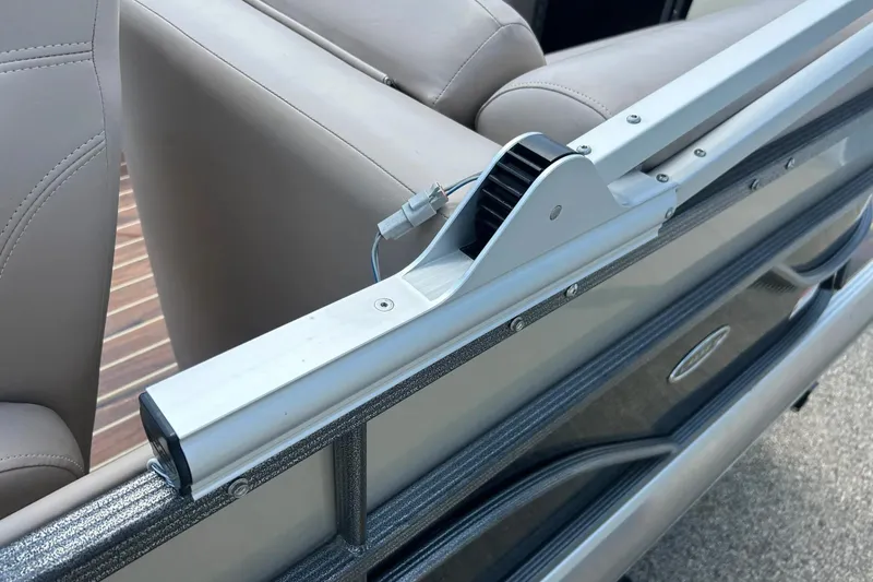 Slide: The Image of 2014 Crest 230 Crest II SLC boat interior with beige seating and metal railing detail. - 29