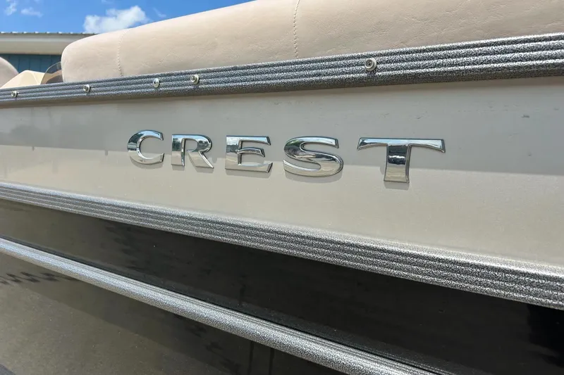 Slide: The Image of 2014 Crest 230 Crest II SLC boat with chrome logo detail. - 5
