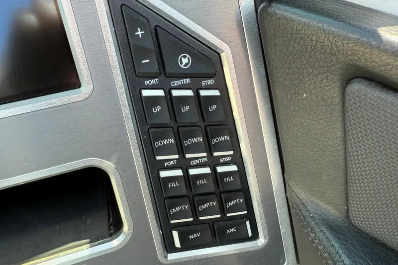 Slide: The Image of Control panel of a 2019 MasterCraft XT22 boat with various function buttons. - 13
